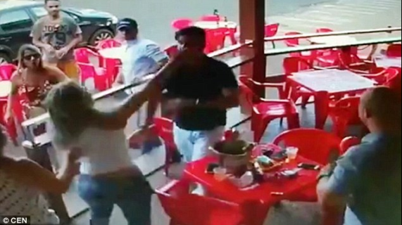 n Watch how this lady punched her man and his mistress after she caught them at a cafe
