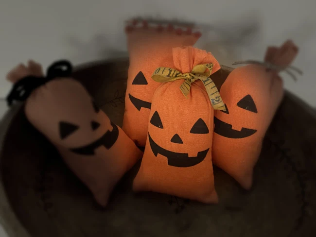 bowl of pumpkin pillows with light