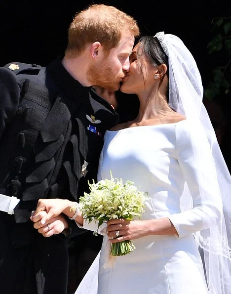 Markle wore a silk organza boat neck long sleeve wedding dress designed by famous British designer Clare Waight Keller.