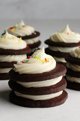 All of the tangy cream cheese flavor you love in the classic frosting, but sturdy enough to be piped and hold it's shape. This decorator's cream cheese frosting is the best parts of buttercream and cream cheese frosting combined. swirls of cream cheese frosting piped between layers of chocolate cookies for cookie stacks