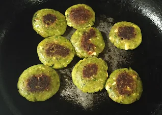 Shallow frying Hara bhara kabab