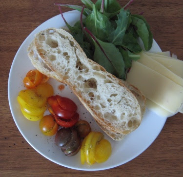 bread, heirloom cherry tomatoes, greens, cheese