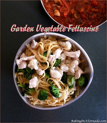 Garden Vegetable Fettuccine, a healthier dinner, includes lots of vegetables and lean chicken served over fettuccine. | Recipe developed by www.BakingInATornado.com | #recipe #dinner