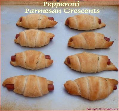 Pepperoni Parmesan Crescents are a quick snack for an afternoon with a book, or just as easily served as an appetizer. | Recipe developed by www.BakingInATornado.com | #recipe #snack