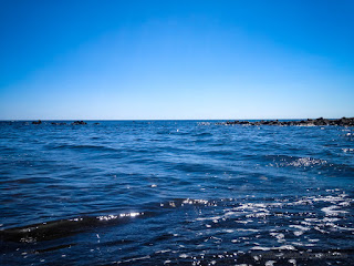 Bright Blue Sea Water Wave View Of Tropical Rocky Beach In The Clear Blue Sky On A Sunny Day At Umeanyar Village North Bali Indonesia