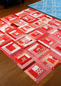 Wonky log cabin quilt in all red - there's a tutorial to make these blocks!