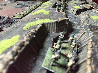 A British rifle section rushes down their trench!