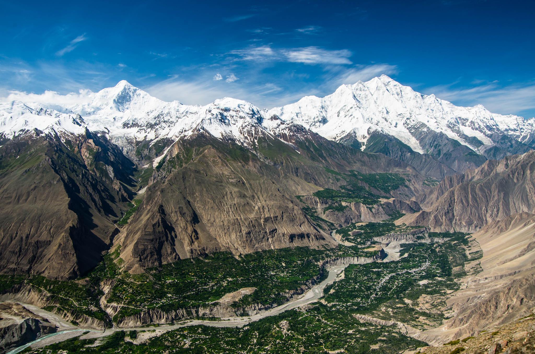 Hunza river, Hunza valley in Gilgit Baltistan. Peak in Nagar valley. Peak in Pakistan  cloud over Mirshik Ar/Mirshikar 5445 m, Sumayar 5630 m, Diran 7,266 m is the mountain to the left and Rakaposhi 7,788 m, Haraj 4732 m is to the right Nagar valley from Hon Pass Hunza valley, Gilgit Baltistan Pakistan