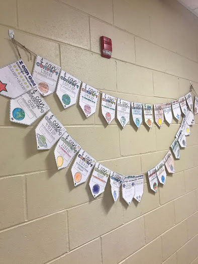 Ms. Doty emailed this photo of her students' converting scientific notation math pennants hanging in the school hallway.