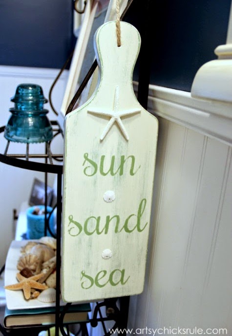 cutting board painted with beach saying