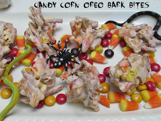 pretzel and candy coated bites on a plate with candy on the bottom 