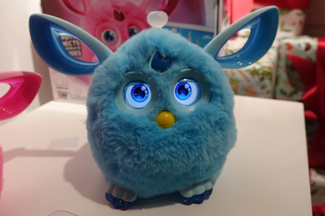 A blue furby connect with it's eyes open