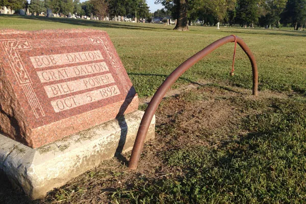 An Iron Gas Pipe Stands Over the Grave of the Dalton Gang at Coffeyville, KS. ~