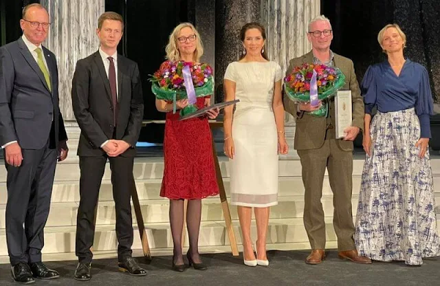 Crown Princess Mary wore a white dress by David Andersen, and Paris white leather pumps by Gianvito Rossi