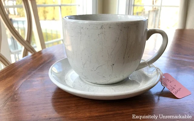 Scratched White Coffee Cup on a table