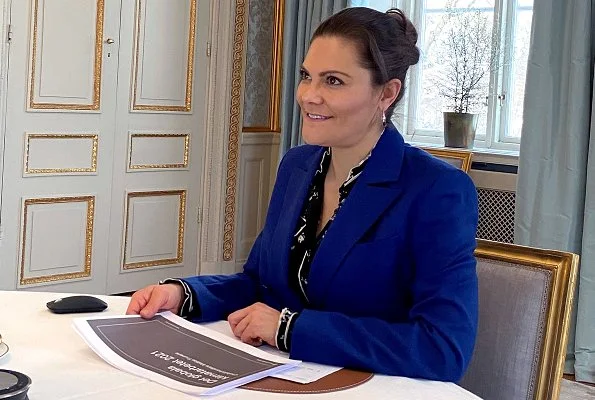 Crown Princess Victoria wore a zoe navy blazer and darcel navy trousers from Rodebjer, and a print blouse from Erdem x H&M collection