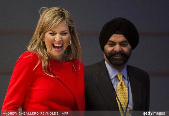 Queen Maxima of the Netherlands laughs next to Ajay Banga, CEO of Mastercard, during a meeting for 'Universal Financial Access 2020' at the IMF/WB Spring Meetings in Washington, DC on