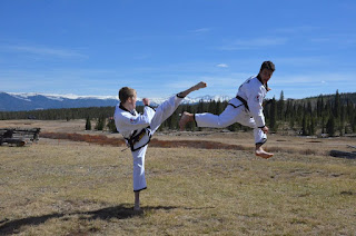 Taekwondo Black Belts Doing High Karate Kicks Taekwondo black belts doing high karate kicks and jump kicks