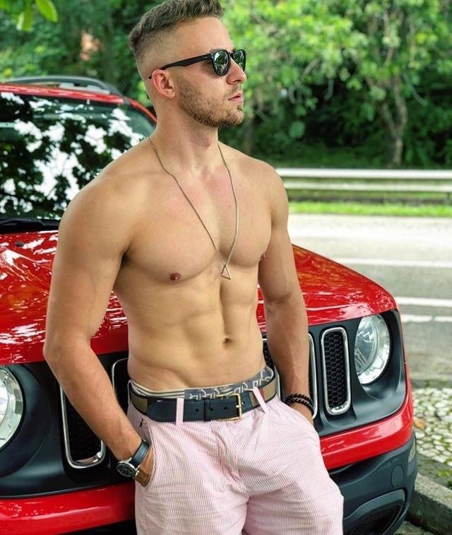 bare-chest-fit-bro-sunglasses-belt-red-car