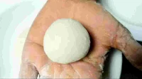 Dough ball on the palm of hand for samosa patti
