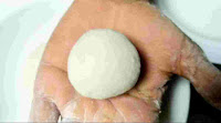 Dough ball on the palm of hand for samosa patti