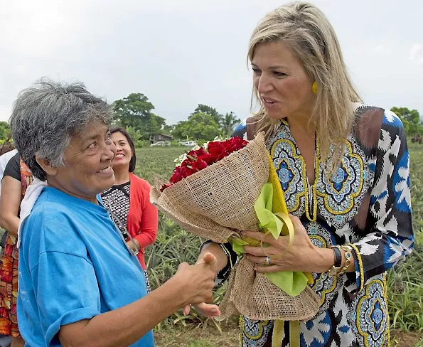 Filipino pineapple growers, during her visit at a Pineapple farm in Tagaytay City, south of Manila, Philippines