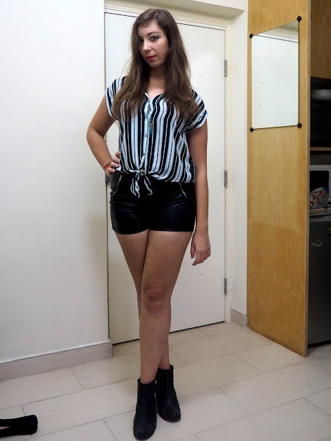 Living on the Edge | outfit of a knotted striped blouse, fake black leather shorts and high heel ankle boots