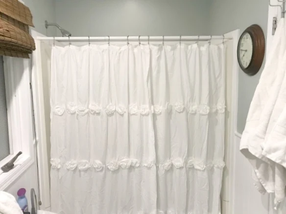 White ruffled shower curtain