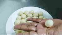 Rolling gulab jamun ball in between palm of hand
