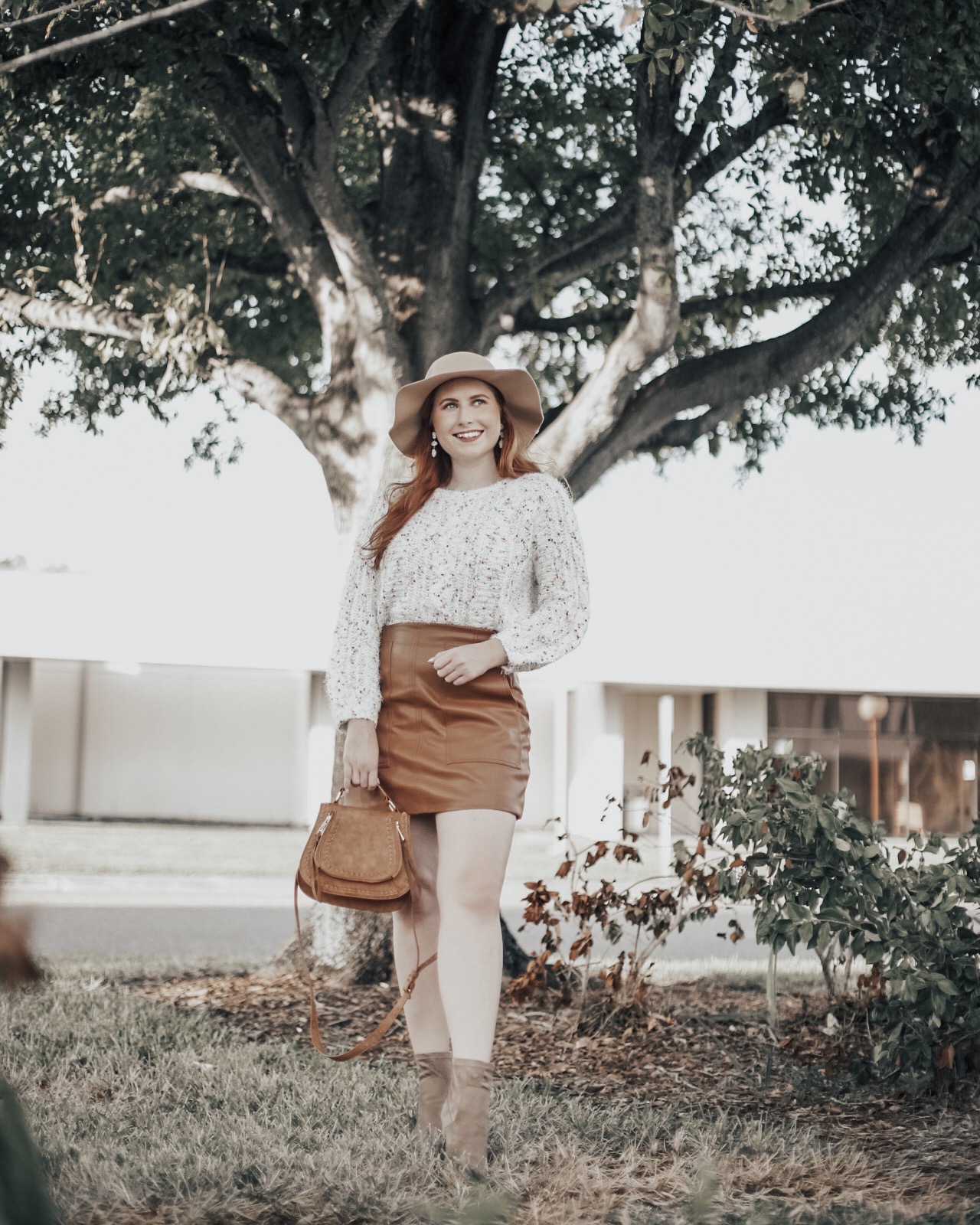 25+ Affordable Sweaters To Wear With Faux Leather Skirts | Affordable by Amanda, a Style Blog by Tampa Blogger Amanda Burrows | Wearing a Forever 21 Faux Leather Skirt and Francesca's Popcorn Sweater | Fall Outfit 2019
