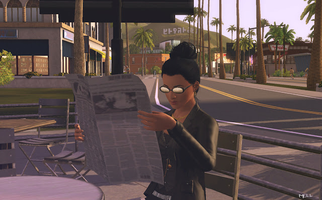 A sim reading a newspaper