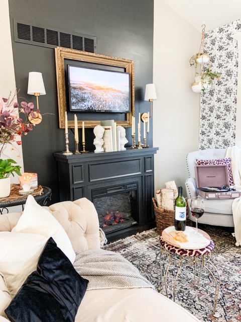 chesterfield couch next to fireplace