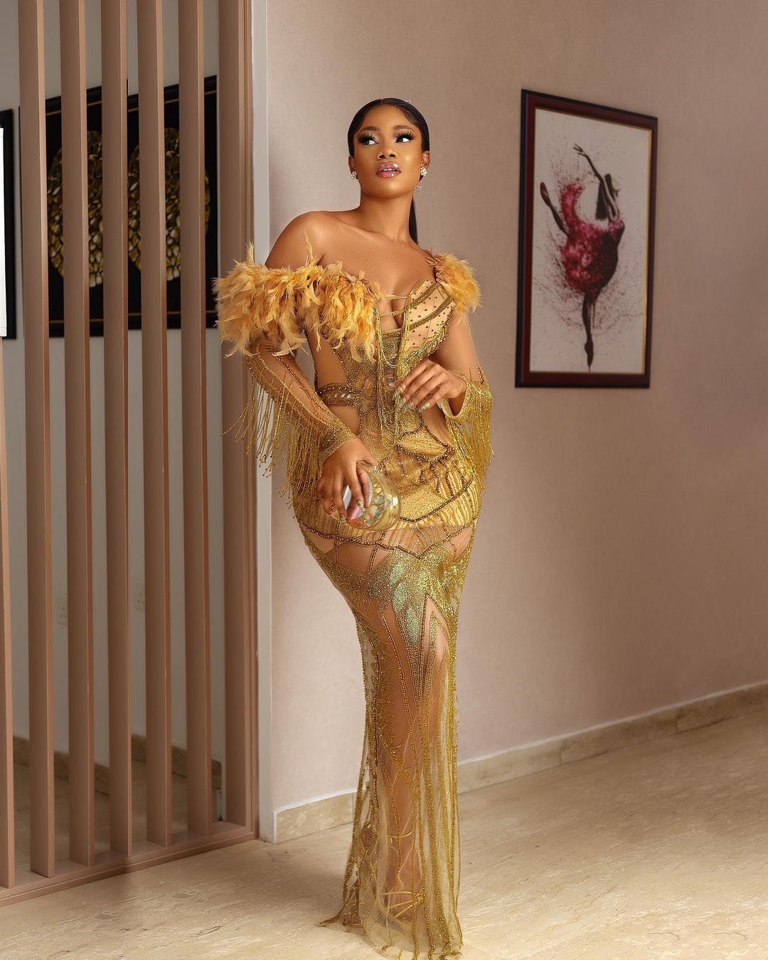 Symply Tacha dazzles in a gold fringe dress