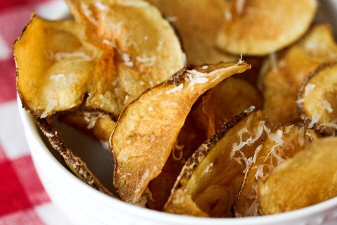 Potato chips sprinkled with parmesan Potato chips sprinkled with parmesan