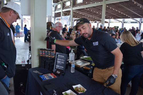 Joel Lickliter of Reload Rub sharing food at the 2019 Scenic City Eggfest