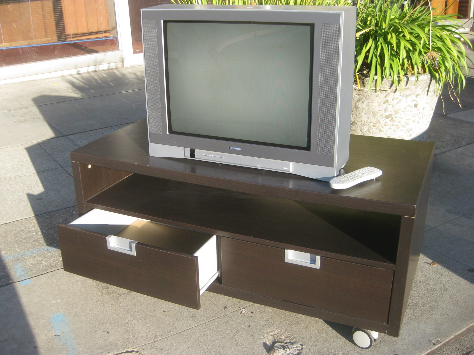 UHURU FURNITURE & COLLECTIBLES SOLD TV Stand and Toshiba TV