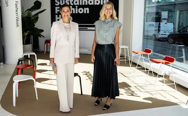 Crown Princess Victoria wore cream suit by Andiata. Kreuger Jewellery summer feather earrings. By Malene Birger Koonia clutch