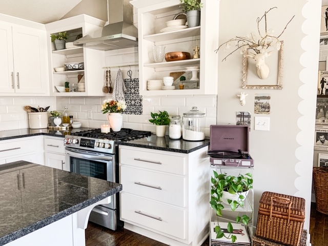 white cabinets, black counter tops, silver handles