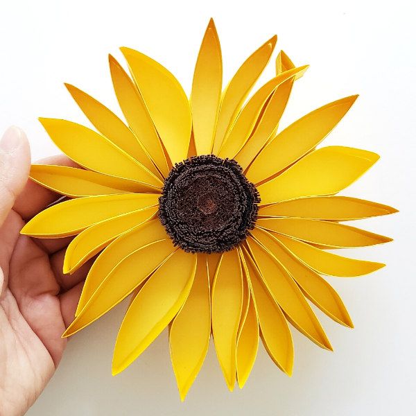 bright yellow paper cut sunflower with brown fringed center