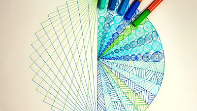 this is the image of a zentangle blue and green drawn using stabilo fine point pens
