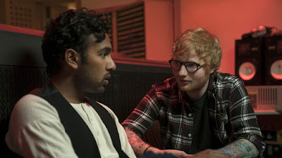 Himesh Patel's character Jack Malik records music and talks with Ed Sheeran inside a studio in the 2019 movie Yesterday