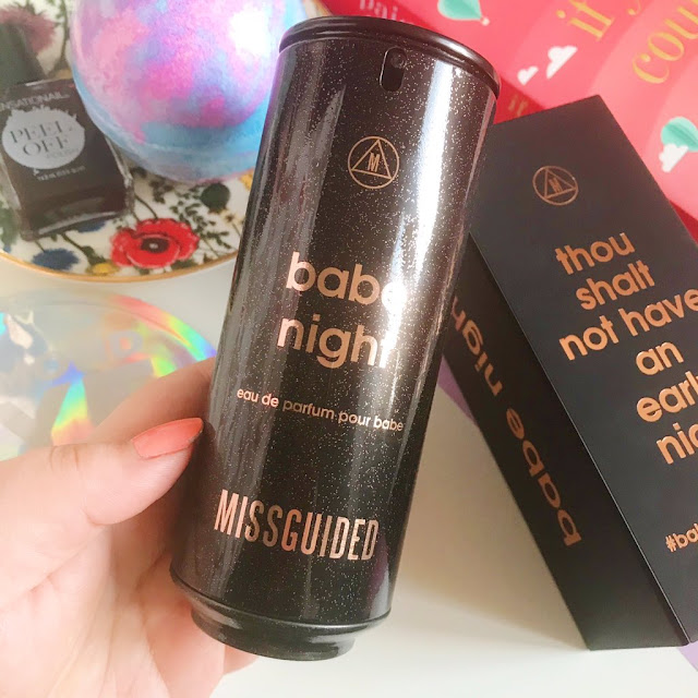 Missguided Babe Night perfume held up over flatlay