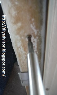 This is the middle inside door frame screw being tightened