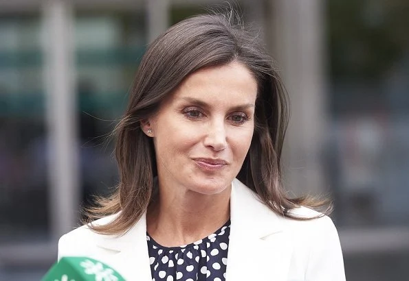 Queen Letizia wore Carolina Herrera navy ecru polka dot silk blouse. Queen Sofía and her sister, Princess Irene of Greece