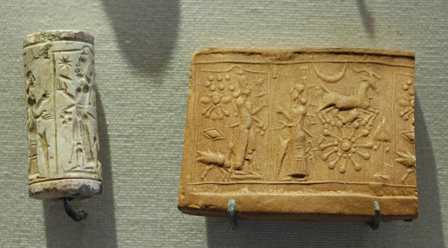 A Mesopotamian limestone cylinder-seal, and a seal impression made on clay by rolling the seal