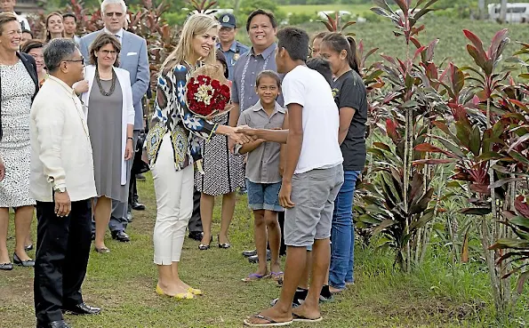 Queen Maxima, is greeted by the Garcia Family