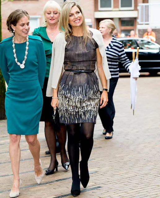 Queen Maxima of The Netherlands visit the Instrumentendepot Leerorkest and hand over the Amalia violin to Sanne Wiering in Amsterdam