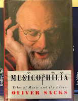 Musicophilia: Tales of Music and the Brain, by Oliver Sacks, superimposed on Intermediate Physics for Medicine and Biology.