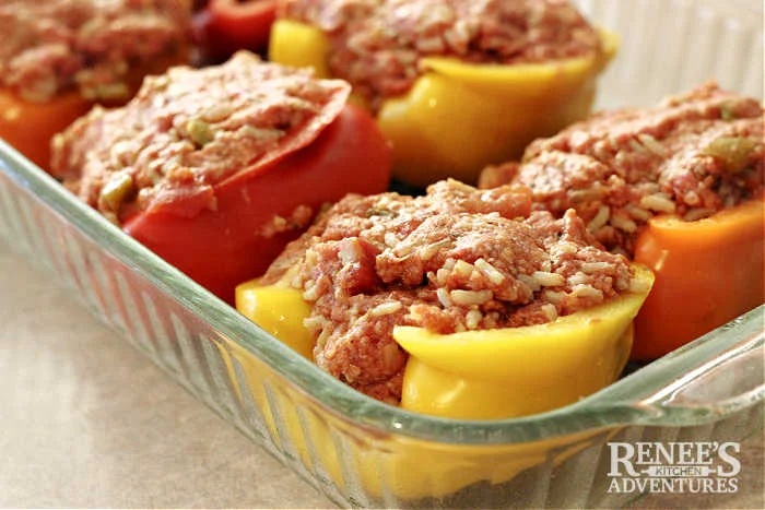 Process image of bell peppers with filling ready for sauce
