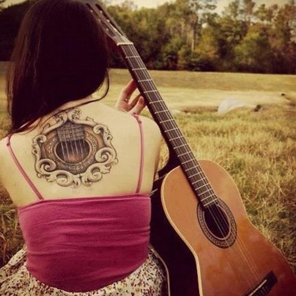 3D guitar tattoo on back 